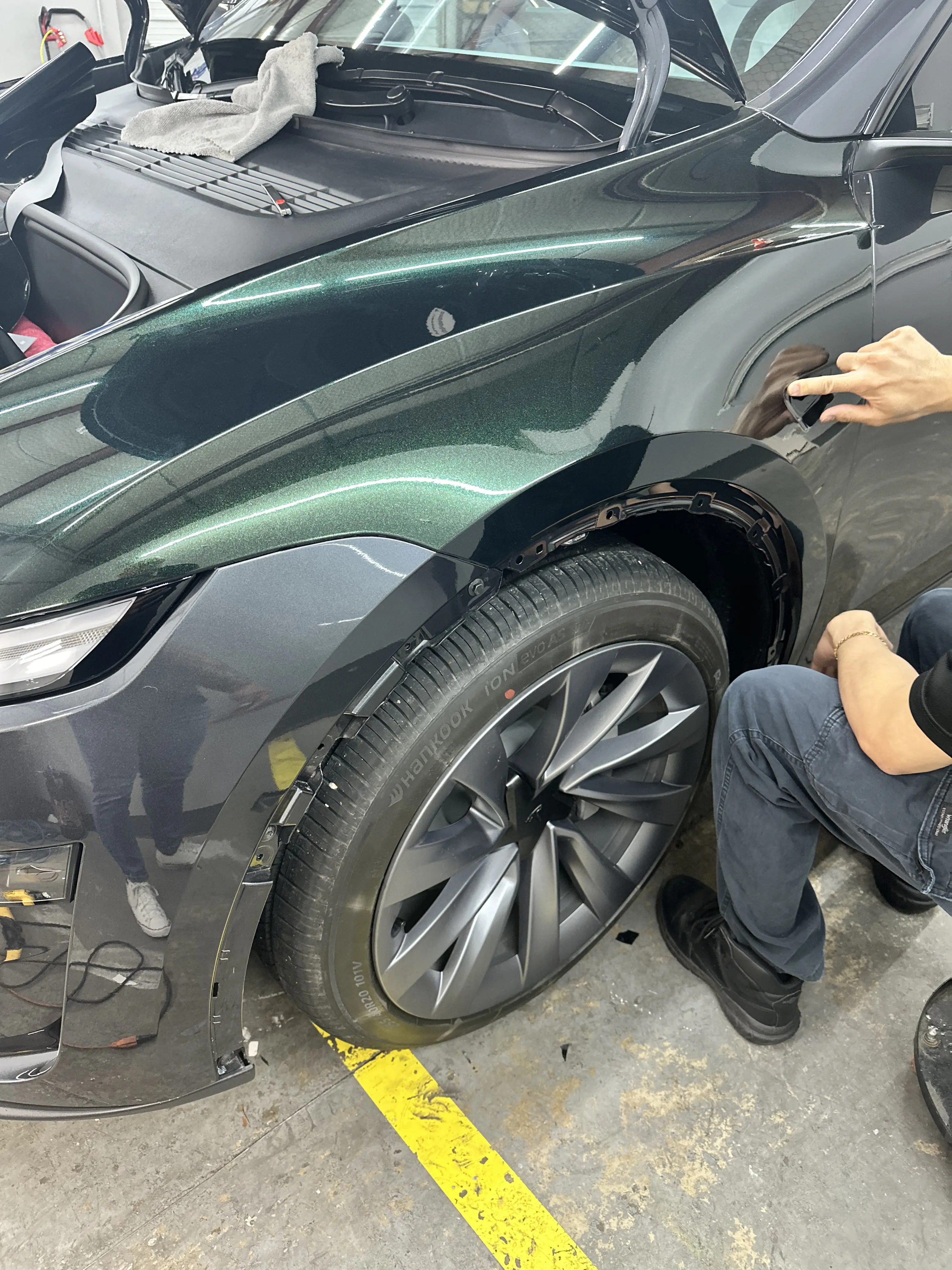 MBC Tint Pros technicians working on a vehicle during a vinyl wrap install