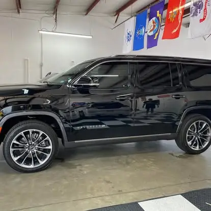Automotive window tinting on a black Jeep Wagoneer