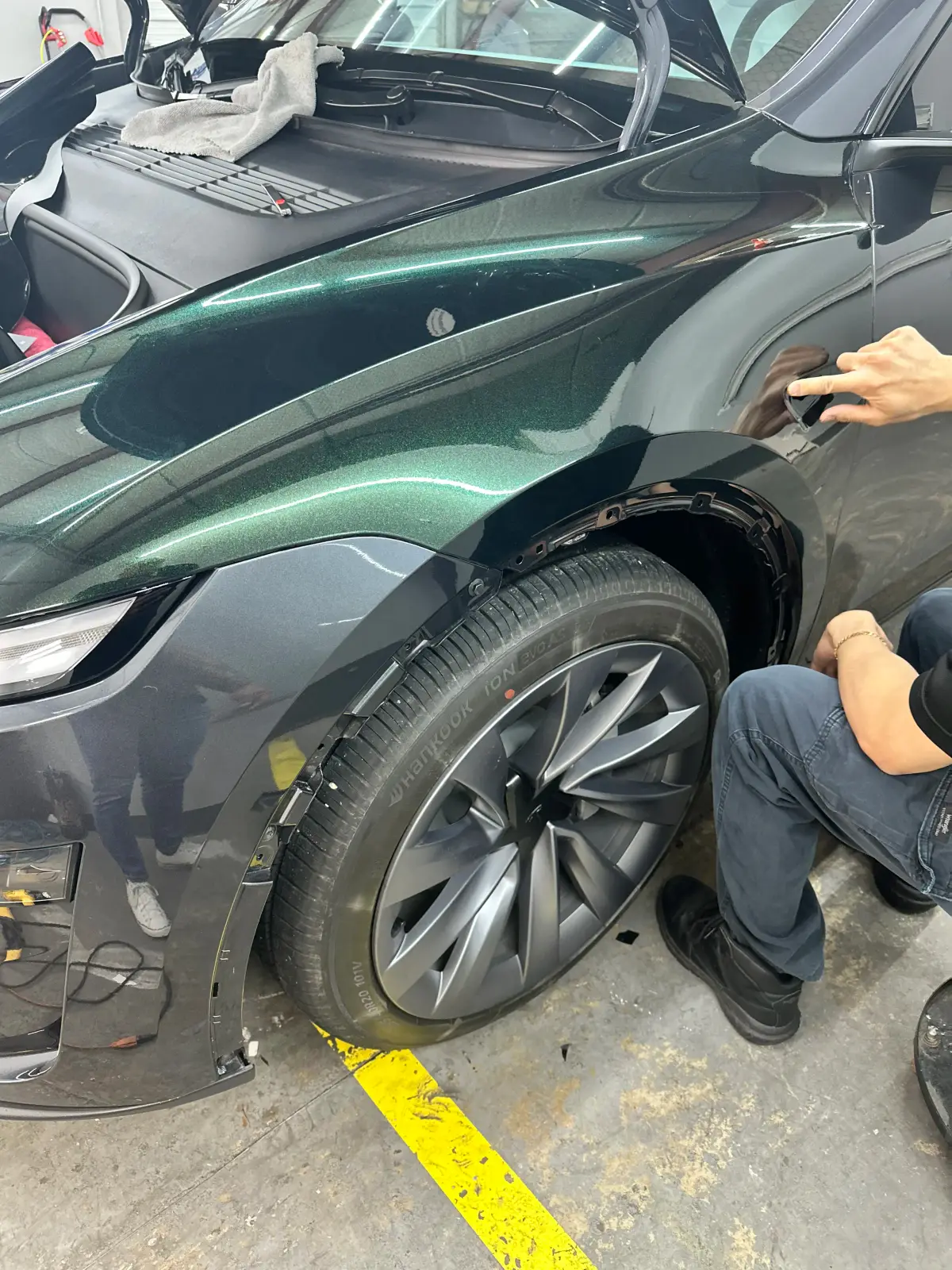 MBC Tint Pros technicians working on a vehicle during a vinyl wrap install