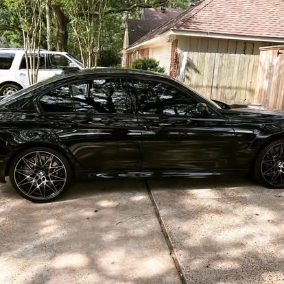 Mirror-gloss ceramic coating finish on a black BMW