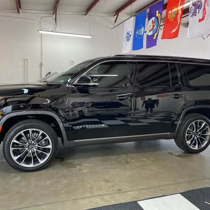 Automotive window tinting on a black Jeep Wagoneer